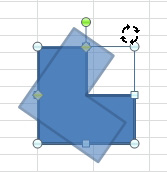 A block L shape. Grab the green rotation and handle and drag left or right to rotate the shape. 